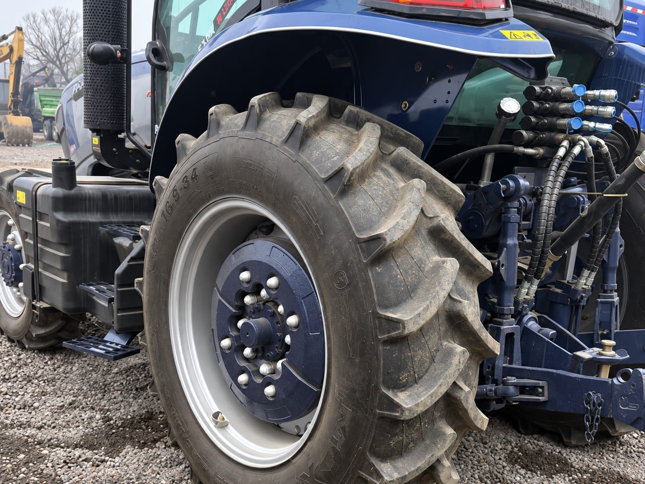 Agriculture Tractor 1604 at the rear: the rear tyre, the hydraulic remote couplers and the three-point linkage